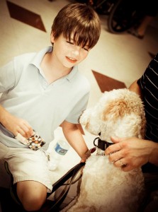 <img src="Evan Moss.jpg" alt="Evan Moss and service dog from 4 Paws for Ability">