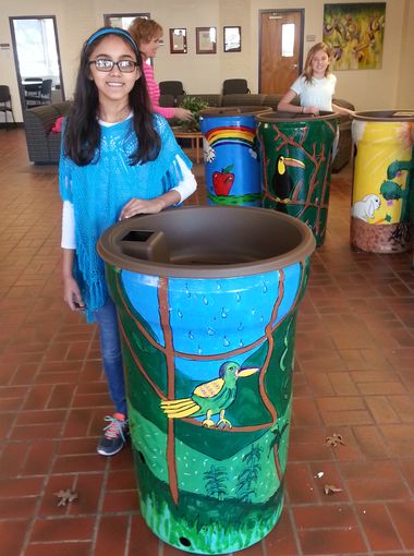 Niyati Kanchan, a student at Ewin H. Greene Intermediate School in Sycamore Township, painted a "Rainforest Riches" rain barrel.